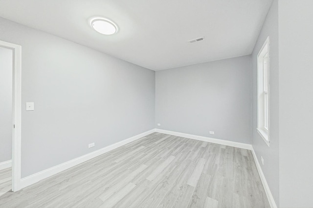 empty room with light hardwood / wood-style floors