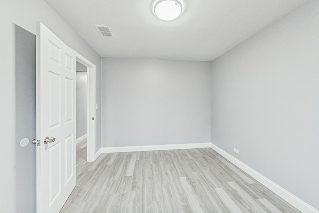 spare room featuring light hardwood / wood-style flooring