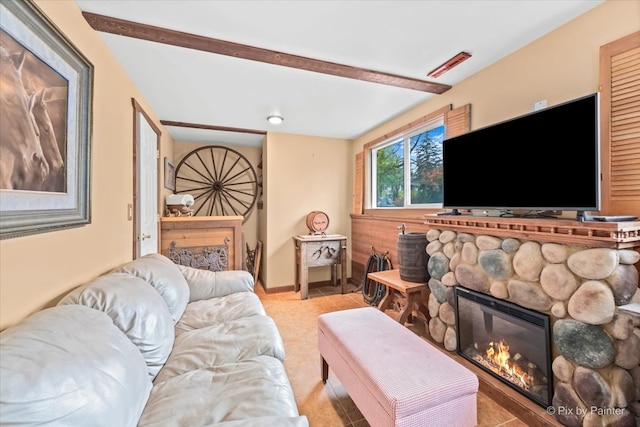 tiled living room featuring a fireplace