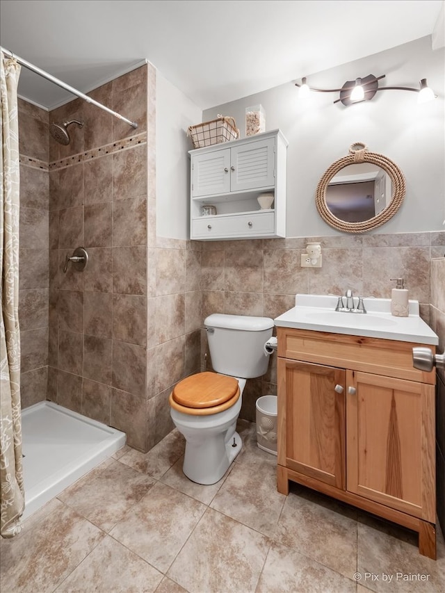 bathroom featuring a shower with shower curtain, toilet, and tile walls