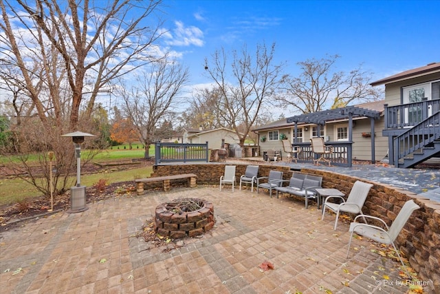 view of patio / terrace with an outdoor fire pit