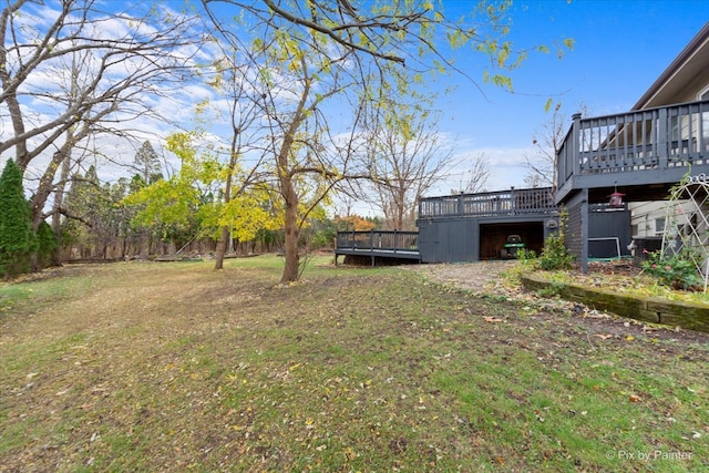 view of yard with a wooden deck