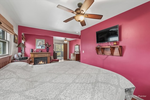 bedroom featuring multiple windows and ceiling fan