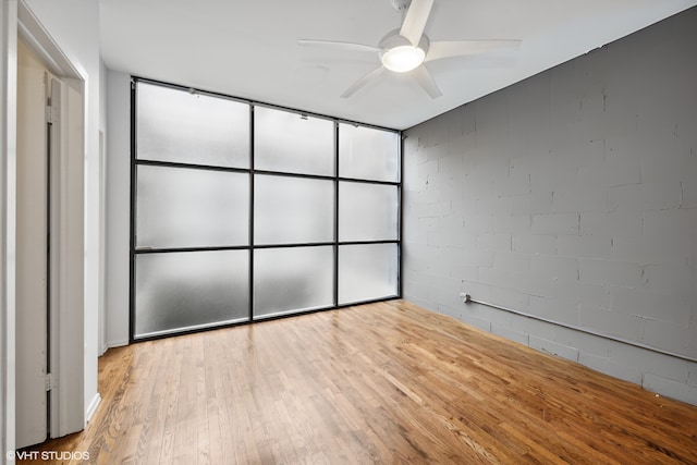 unfurnished bedroom featuring ceiling fan and light hardwood / wood-style flooring