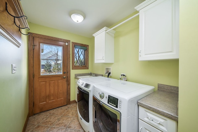 laundry room featuring cabinets, sink, and washing machine and dryer