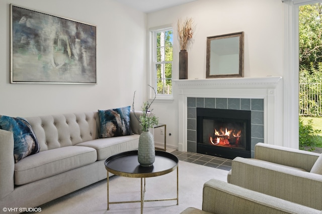 living room with a tiled fireplace