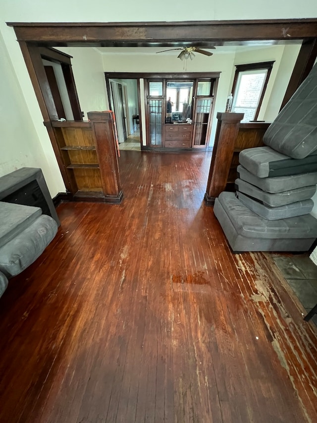 interior space with ceiling fan and dark hardwood / wood-style floors