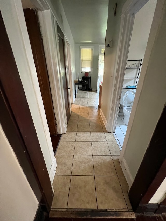 corridor with light tile patterned floors