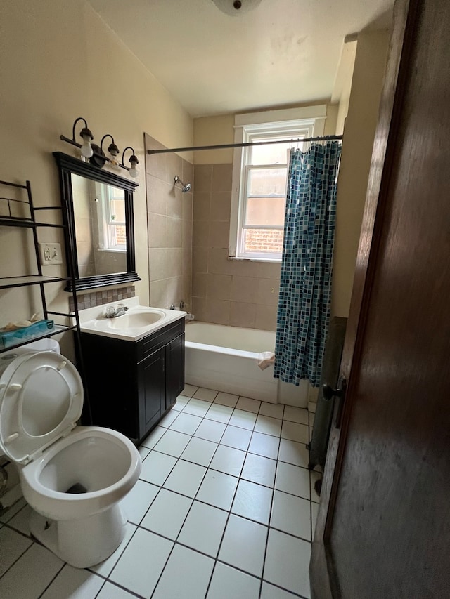 full bathroom with tile patterned flooring, shower / tub combo, vanity, and toilet