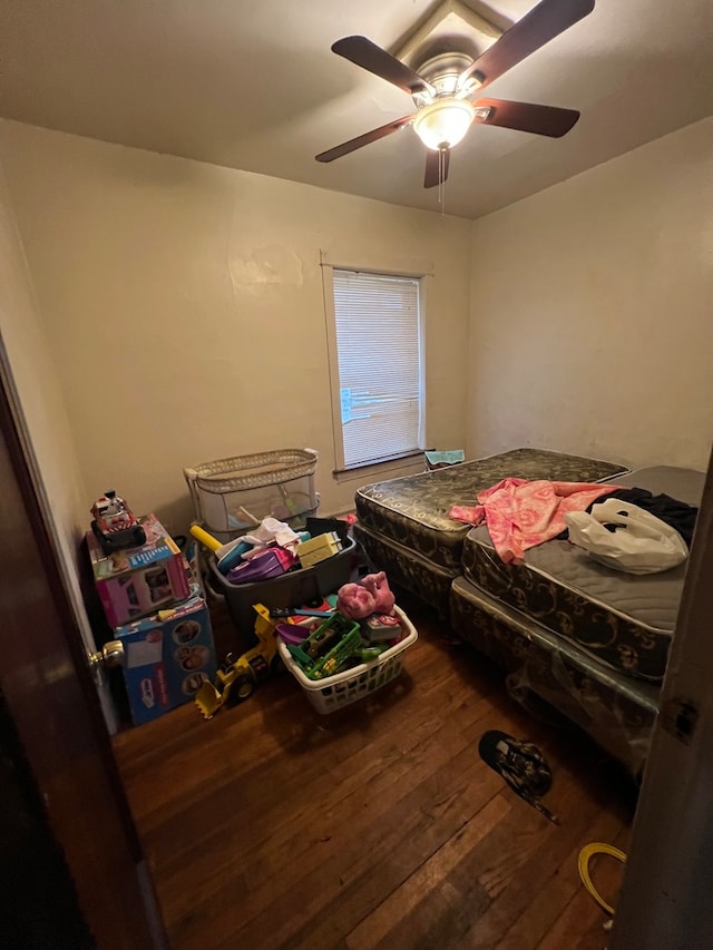 bedroom featuring ceiling fan and hardwood / wood-style flooring