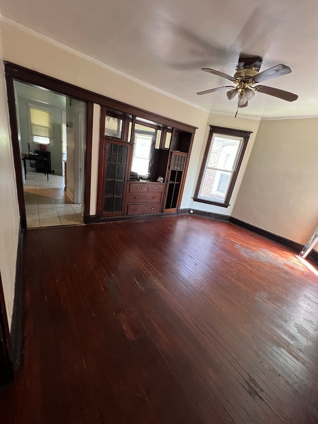 unfurnished living room featuring light wood-type flooring, ceiling fan, and ornamental molding