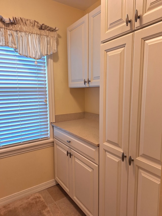 kitchen featuring white cabinetry