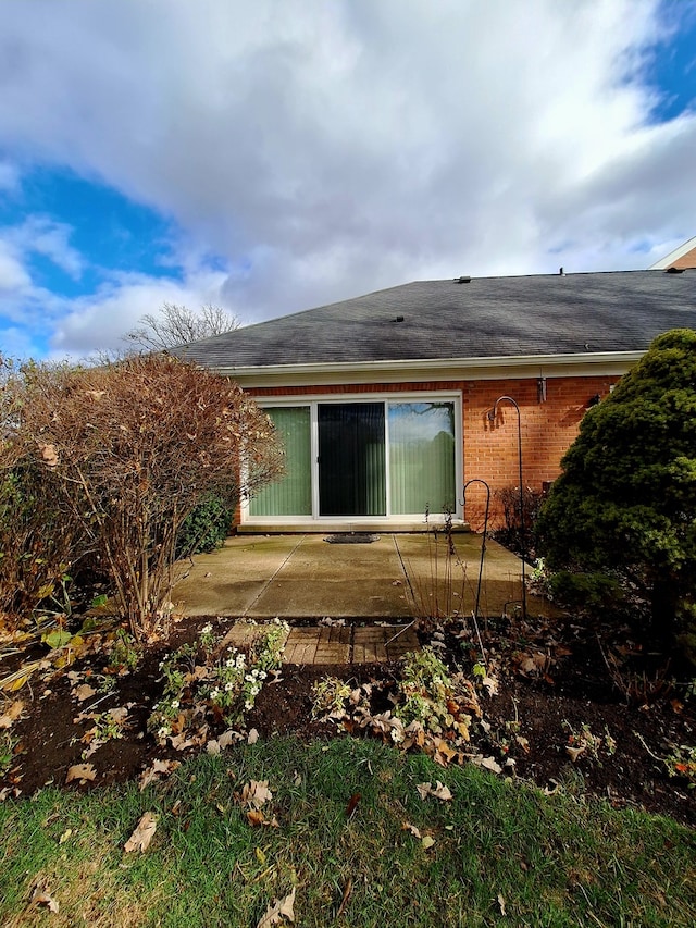 back of property with a patio area