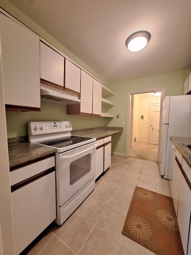 kitchen featuring white cabinets, white appliances, and light tile patterned floors