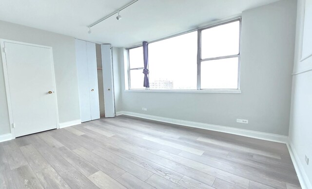 full bathroom with tile patterned floors, vanity, tiled shower / bath combo, and toilet