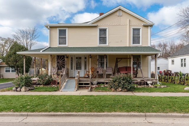 view of front of house featuring a front yard and a porch