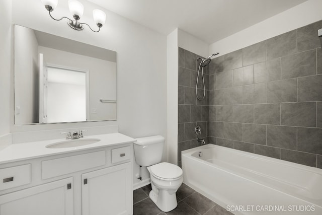 full bathroom with toilet, tile patterned flooring, vanity, and tiled shower / bath