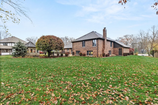 view of side of home with a lawn