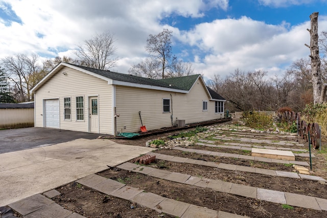 view of side of home featuring a garage