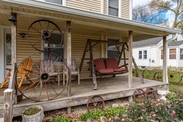 wooden terrace featuring a porch