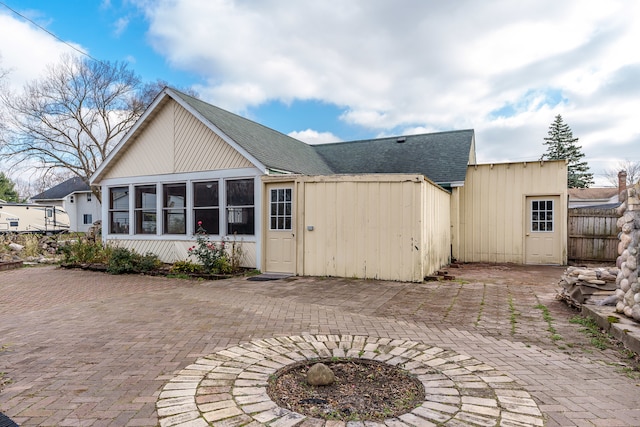 rear view of property featuring a patio