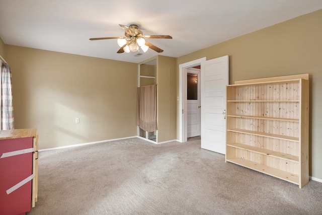 unfurnished bedroom featuring carpet and ceiling fan