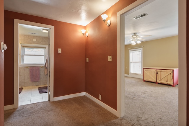 hallway with light carpet