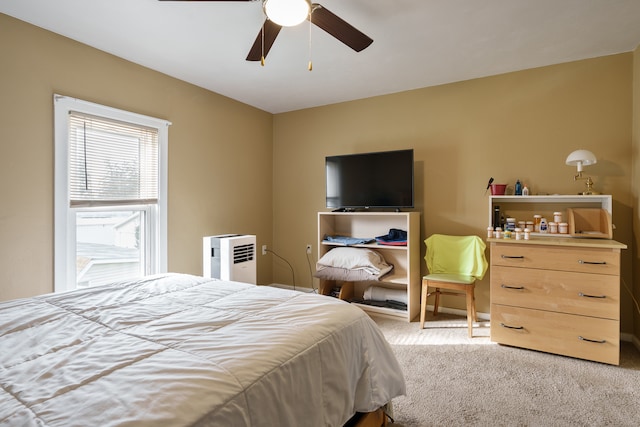 bedroom featuring ceiling fan and light colored carpet