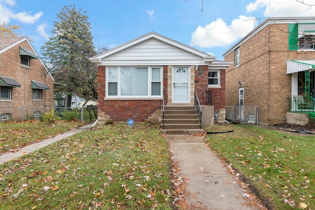 bungalow-style home featuring a front lawn