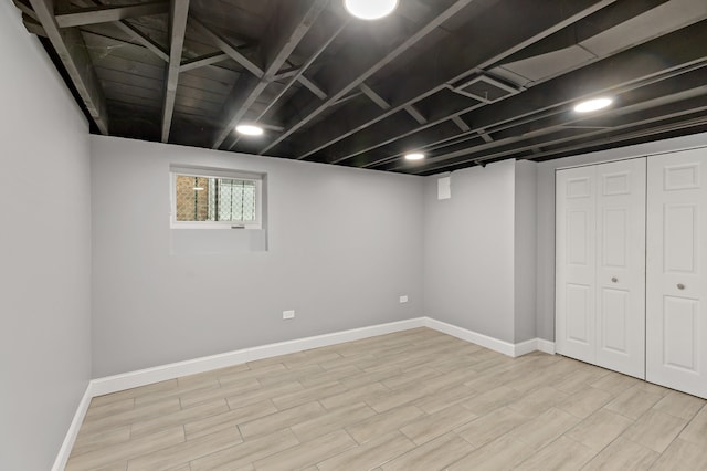 basement featuring light hardwood / wood-style floors