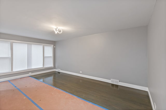 spare room featuring hardwood / wood-style floors