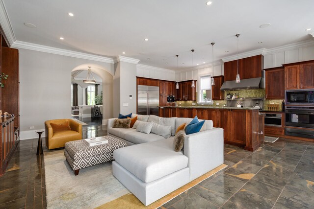 460 W Huron St, Chicago, IL 60654 - living area with plenty of natural light, arched walkways, recessed lighting, ornamental molding, and baseboards