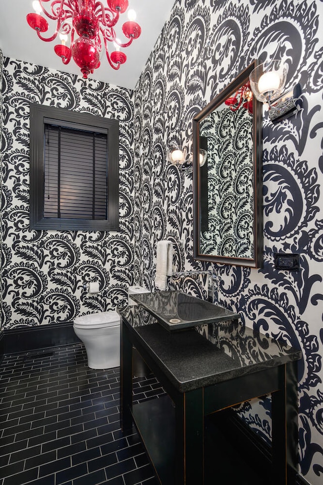 bathroom with tile patterned floors, vanity, and toilet