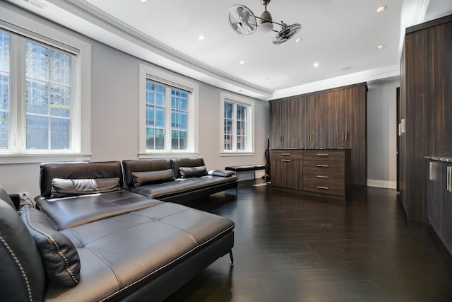 living room with dark hardwood / wood-style floors and crown molding