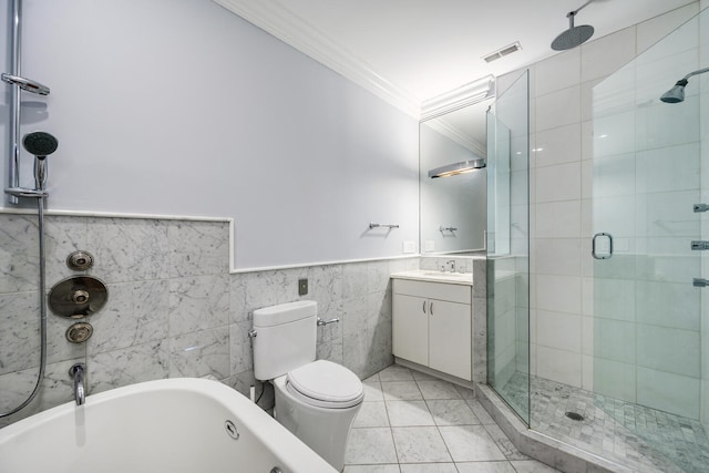 full bathroom featuring vanity, crown molding, toilet, tile walls, and independent shower and bath