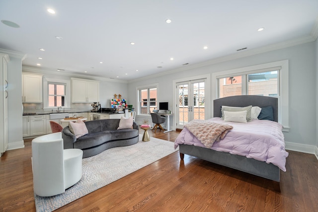 bedroom with access to exterior, french doors, dark hardwood / wood-style flooring, and crown molding