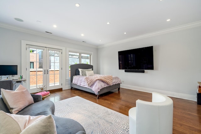 bedroom featuring access to exterior, french doors, ornamental molding, and dark wood-type flooring