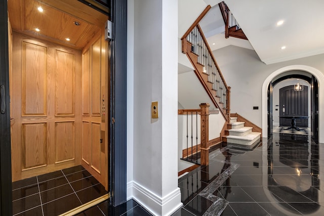interior space featuring ornamental molding and elevator