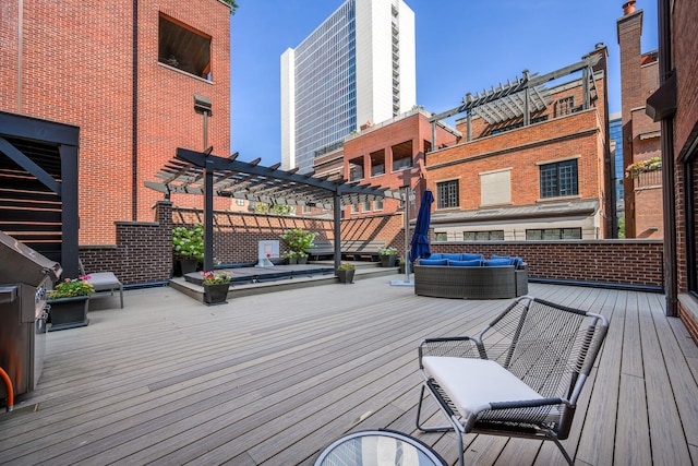 wooden deck featuring an outdoor hangout area and a pergola