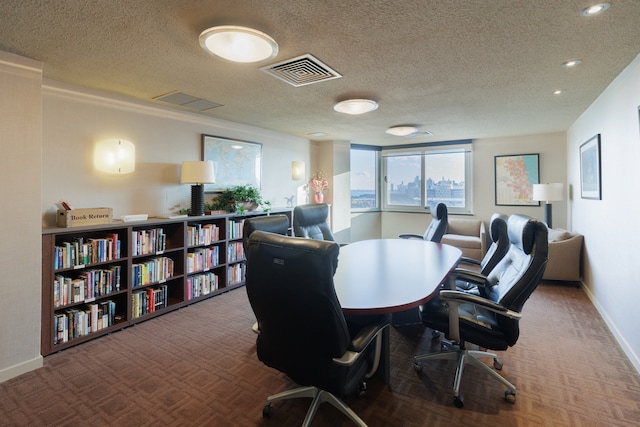 office area featuring carpet and a textured ceiling