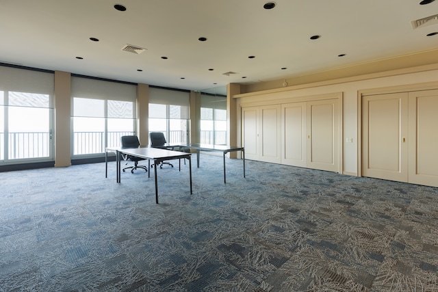 playroom with dark colored carpet