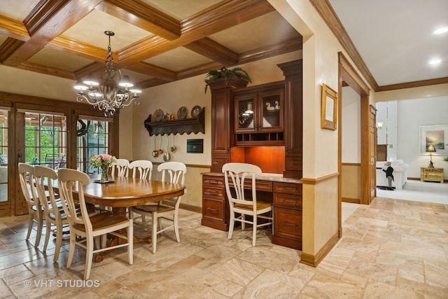 dining space with beam ceiling, ornamental molding, coffered ceiling, and a notable chandelier