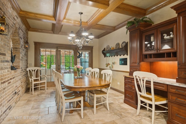 dining area with french doors, ornamental molding, beam ceiling, brick wall, and a chandelier