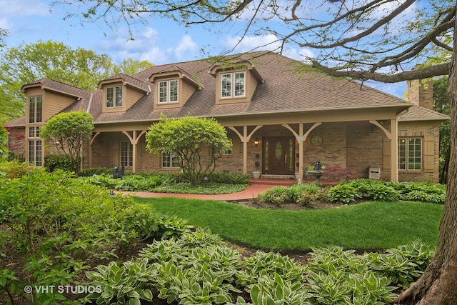 view of front facade with a porch and a front lawn