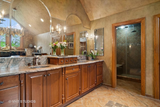 bathroom with vanity, an enclosed shower, and lofted ceiling