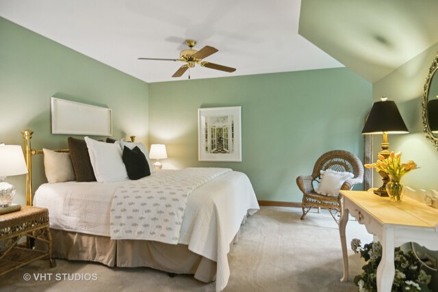 carpeted bedroom with ceiling fan