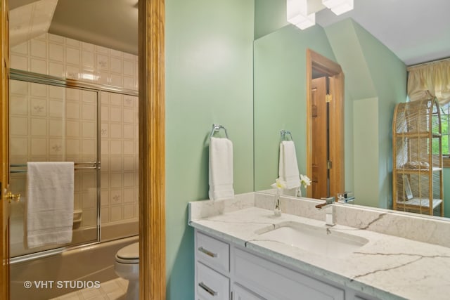 full bathroom with toilet, vanity, and combined bath / shower with glass door