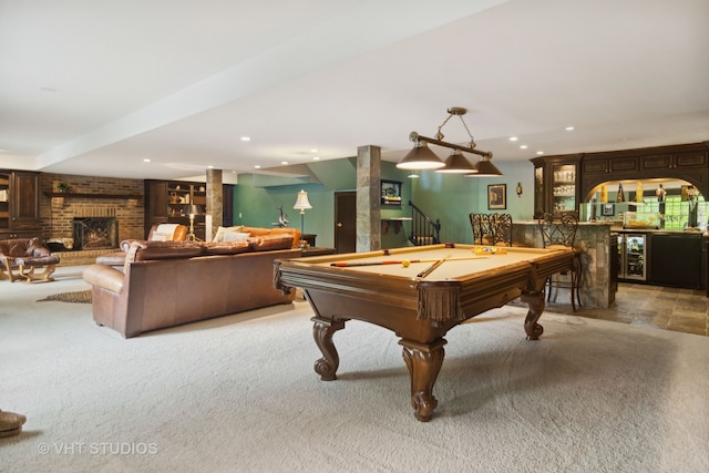 playroom with light carpet, beverage cooler, billiards, a fireplace, and bar