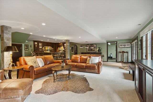 living room featuring light carpet