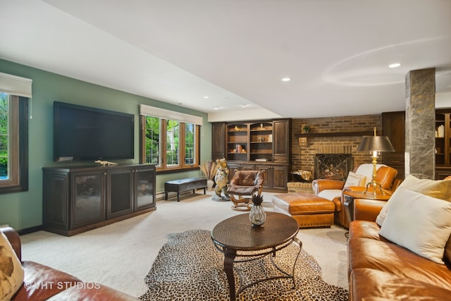 carpeted living room featuring a fireplace